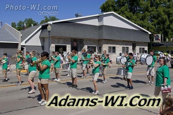 School marching band in parade. School marching band in parade.